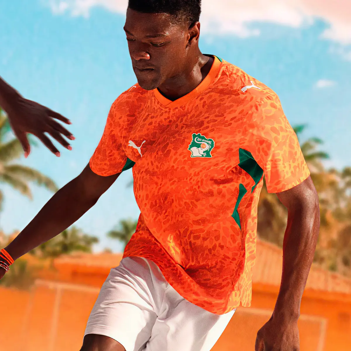 Ivory Coast football player wearing 2026 World Cup home jersey with custom font