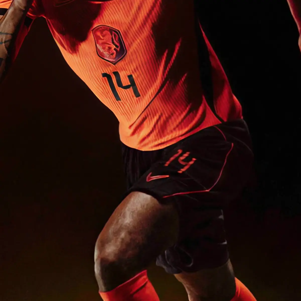 Netherlands football player wearing 2026 World Cup home jersey with custom font preview